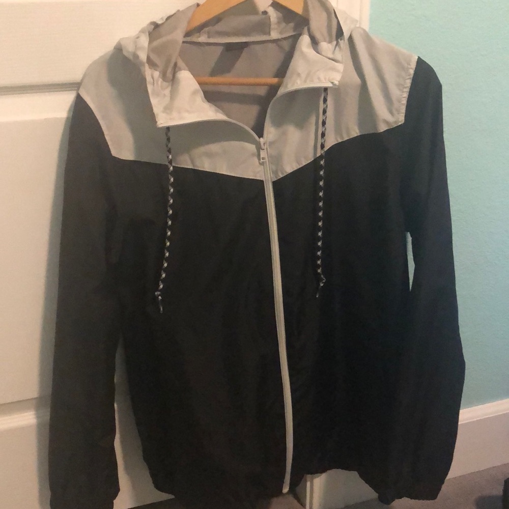 Black and greyish, whiteish windbreaker
